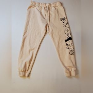 Peanuts pale pink sweat pants with Charlie Brown characters on right leg, Large